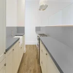 Pro-Tek™ Editions Classic Battersea Oak Luxury Click Vinyl Flooring Installed in a Modern Kitchen