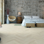 Pro-Tek™ Editions Herringbone Hampton Grey Luxury Vinyl Click Flooring Installed ina Bedroom