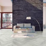 Pro-Tek™ Editions Herringbone Chatsworth Grey Luxury Vinyl Click Flooring Installed in a Modern Living Room