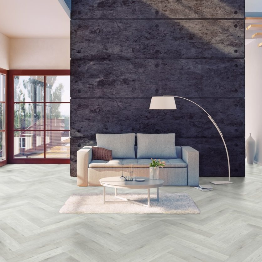 Pro-Tek™ Editions Herringbone Chatsworth Grey Luxury Vinyl Click Flooring Installed in a Modern Living Room