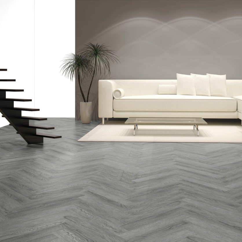 Pro-Tek™ Editions Herringbone Buckingham Grey Luxury Click Vinyl Flooring Installed in a Living Room