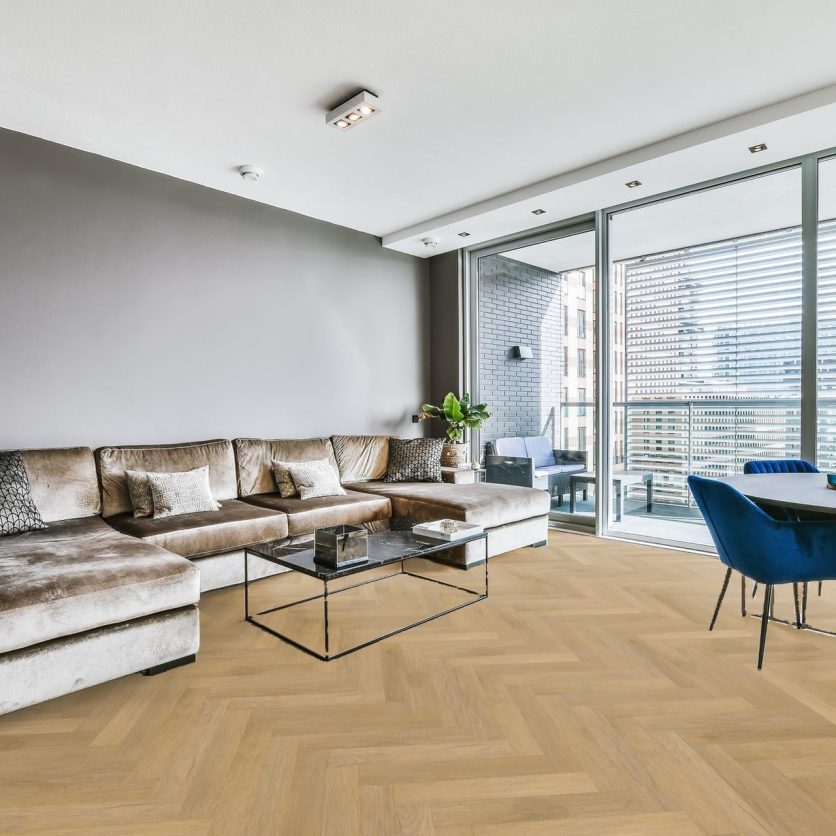 Pro-Tek™ Editions Herringbone Blenheim Oak Luxury Click Vinyl Flooring installed in a Modern Living Room