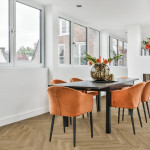 Pro-Tek™ Editions Herringbone Arundel Walnut Luxury Click Vinyl Flooring Installed in a Dining Room