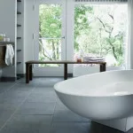 Pro-Tek™ Editions Tiles Vesuvian Marble Luxury Vinyl Click Flooring Installed in a Modern Bathroom